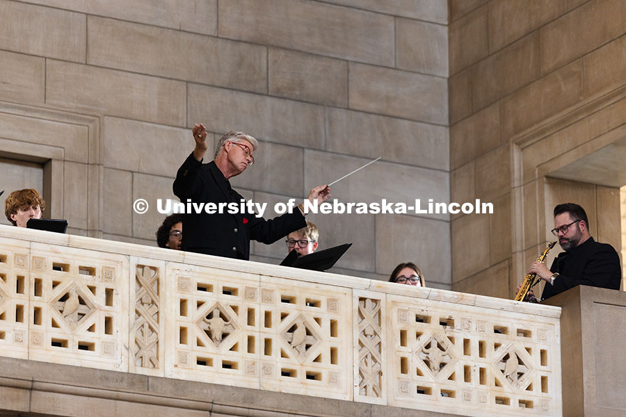 Peter Eklund, Choir Director and Professor of Music, conducts a performance of "One Voice" in the Ro