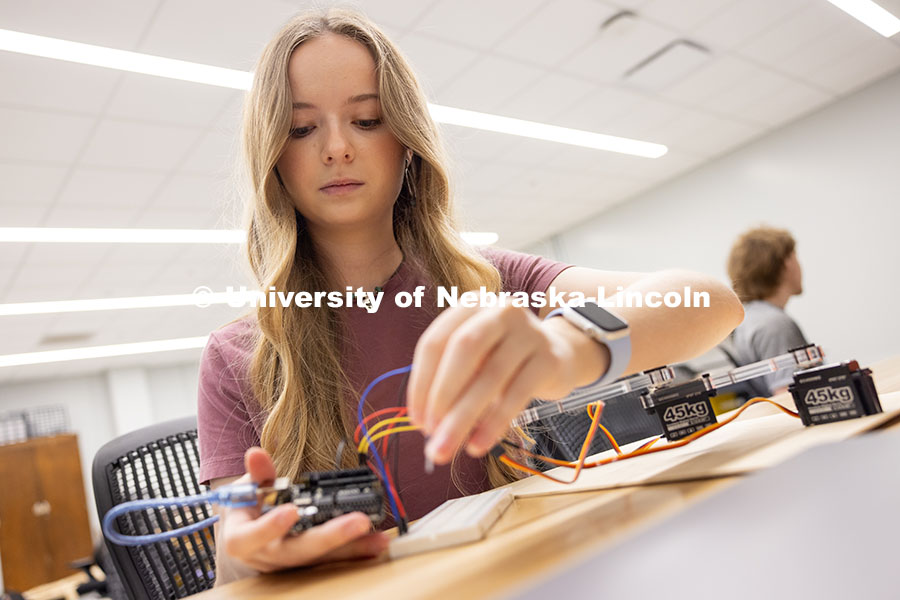 Aleksandra Stansbury, sophomore from Omaha, robotics engineering major, connects to her planar robot