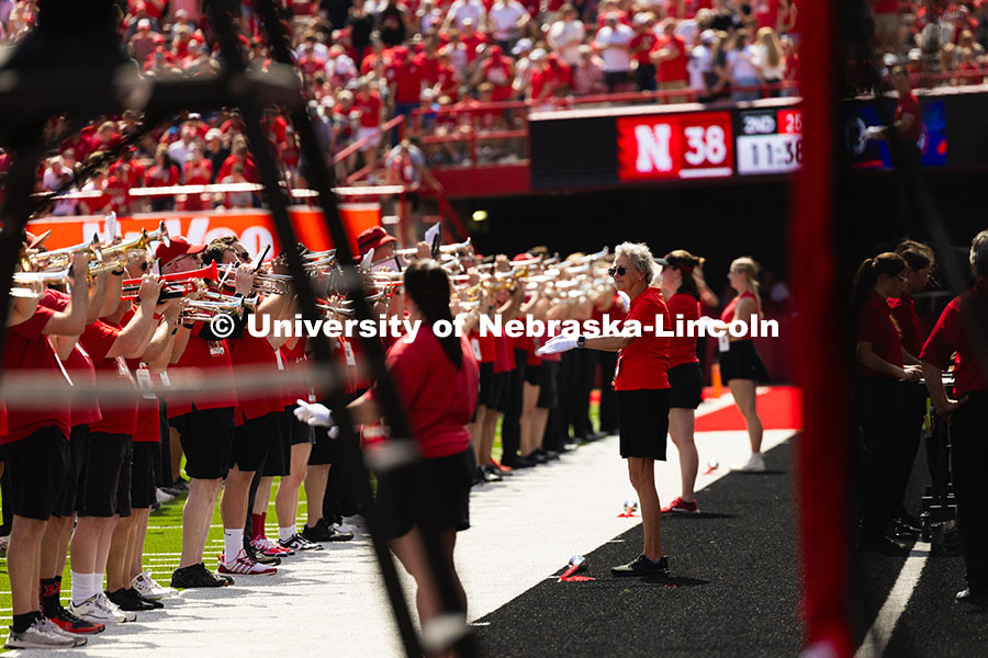 250913_NU_vs_HCU_7438.jpg Diane Frost (second from left) returned to the field in Memorial Stadium for the first time since 19