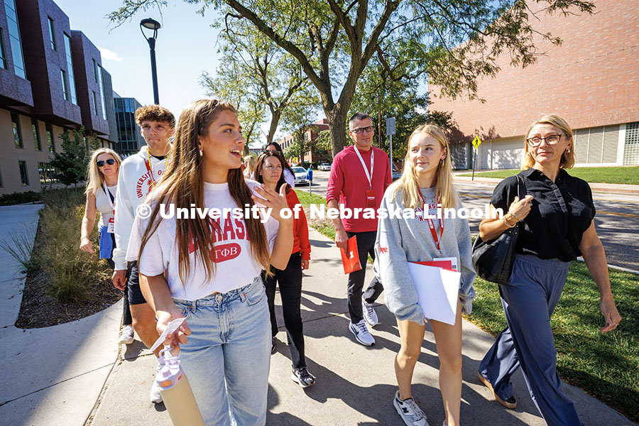250919_Red_Letter_Day_729.jpg Sophomore, Arihanna Marlatt (left), leads a tour group past Caroline Pope Edwards Hall on Red Letter