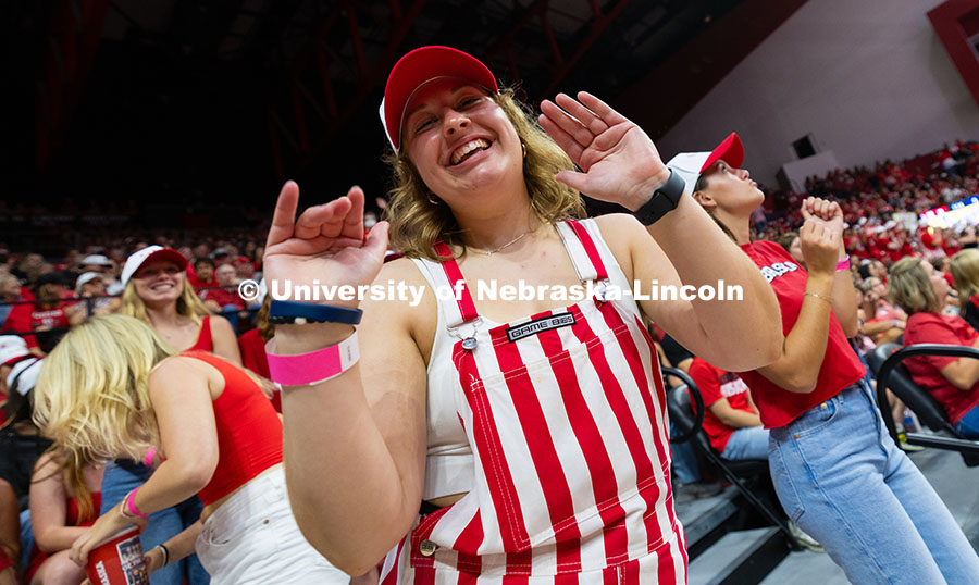 Sophie Rohlfing, a junior studying forensic science, dances in her striped bib overalls with friends