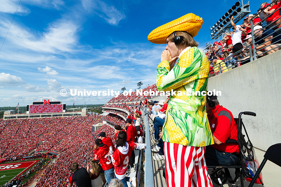 Jordan Kouma, a student at Southeast Community College, cheers from the top of east stadium as the H