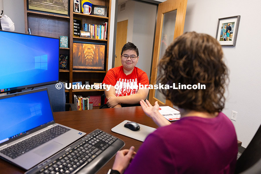 250922_Honors_Program_8618.jpg Huy Le, a senior in the Honors Program studying agricultural economics, speaks with Rebecca Baskervi