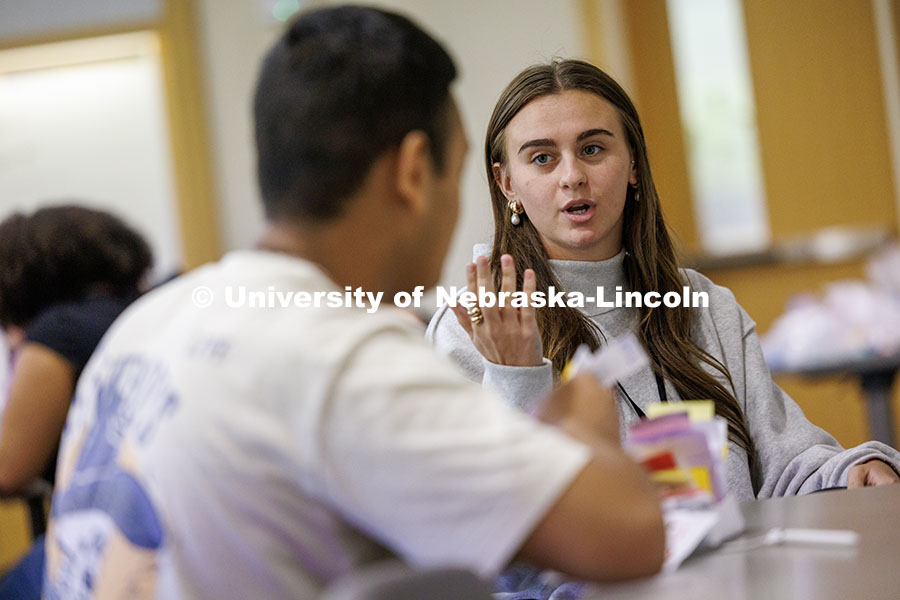 Kallie Edins, right, junior hospitality, restaurant, and tourism management major, rehearses her pre