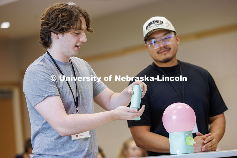 Alex Simetich, left, and Kevin Escamilla present their loot-box vitamin dispenser inside Howard L. H