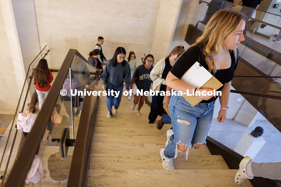 Students in the Music for Non-Majors 171: Arts Alive at Nebraska course climb the stairs to the Coll