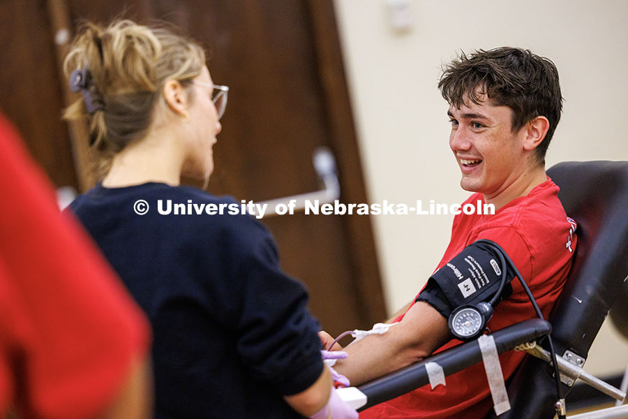 Owen Weiche, junior political science major, gives blood during the 2025 Homecoming Blood Drive insi