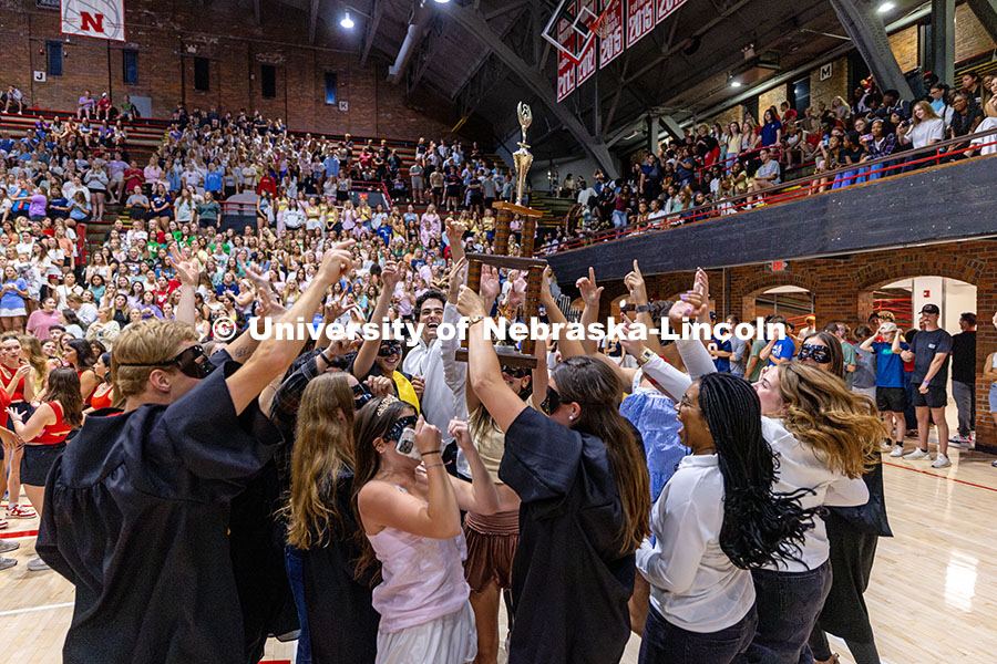 250929_Showtime 2025_2773.jpg Mortarboard holds up the first-place trophy after winning showtime for their category. Recognized St