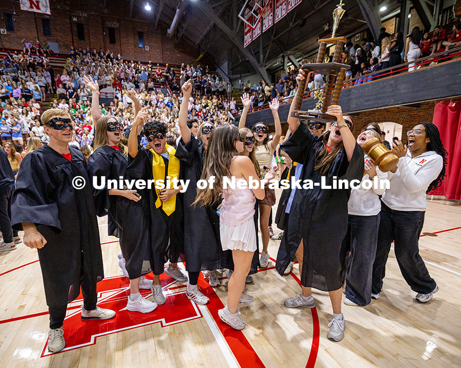 250929_Showtime 2025_2775.jpg Mortarboard holds up the first-place trophy after winning showtime for their category. Recognized St