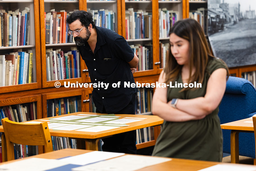 251002_Husker_History_8715.jpg Gabe Bruguier, Assistant Professor for University Libraries, views copies of letters typed by author