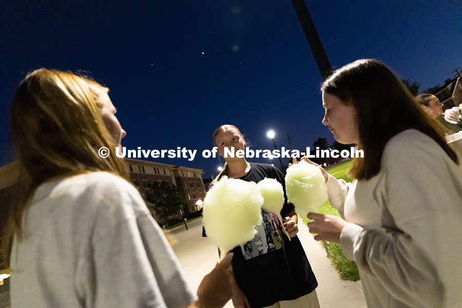 Claire Schaunaman, Hattie Bennett and Abigail Conrad get cotton candy before watching the film "Wick