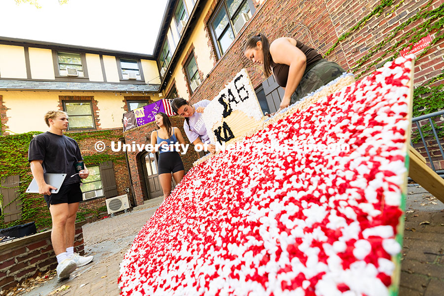 Maddie Balus, a junior in Kappa Delta, chats with a Sigma Alpha Epsilon member in the fraternity's c