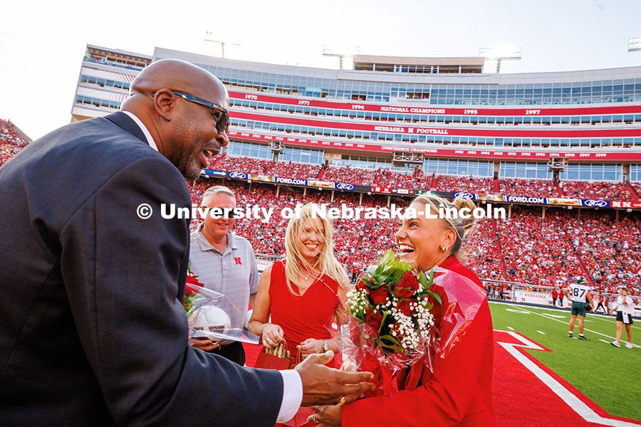 Ava Hollingsworth, one of the two female 2025 Homecoming winners, shakes Chancellor Rodney D. Bennet