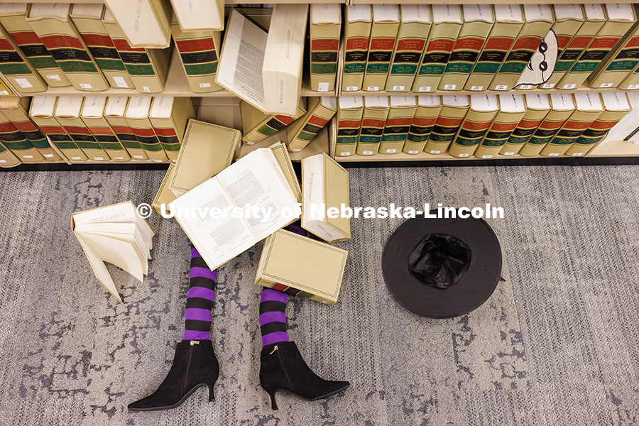 251010_East_Campus_001.jpg A witch is covered in large law books inside the Marvin and Virginia Schmid Law Library on East Camp