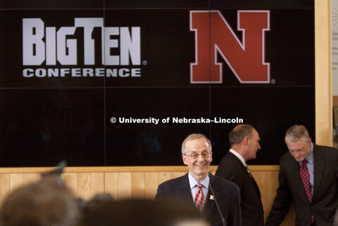UNL Chancellor Harvey Perlman is all smiles as he discusses the Husker's new conference.  In the bac