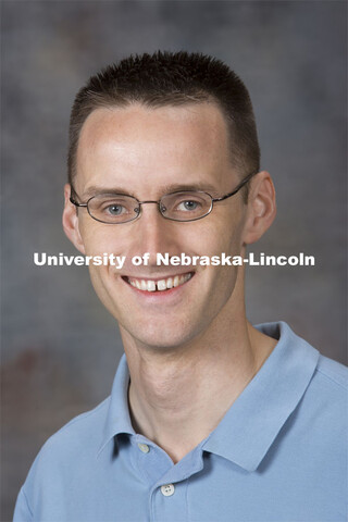 Studio portrait of Adam Larios, Assistant Professor, Mathematics. August 20, 2014. 