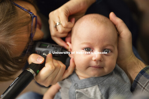 HearU Nebraska photos for CEHS. Eli Horst, 9 weeks old, has a hearing check consisting of the usual 