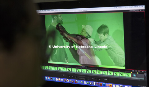 A computer screen shows an image of Thalia Rodgers’ hand and brush as she creates an animation by 