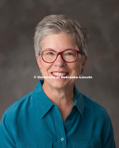 Studio portrait of Nancy Mitchell, Director of Undergrad Education Programs for Academic Affairs. Ju