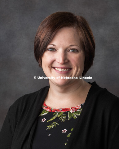 Studio portrait of Andrea Schreiber, Grants Coordinator for the Office of Research and Development, 