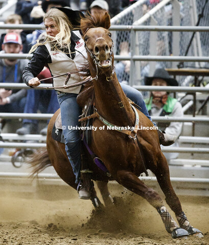 Angelica Wellman rounds a barrel during the barrel racing event. 60th anniversary of the University 