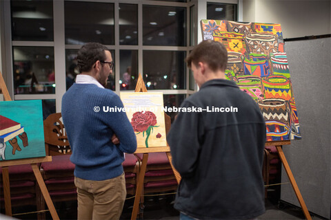 Our Nebraska: Express Yourself Expo in the Oasis Center. Students viewing the different art projects