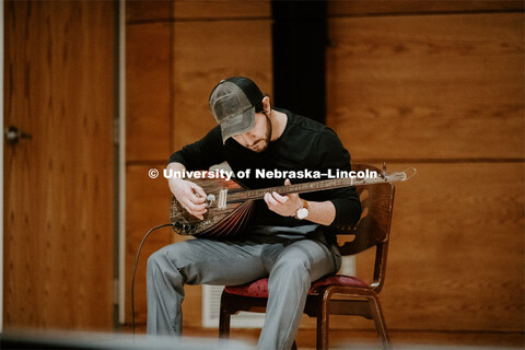 Our Nebraska: Express Yourself Expo in the Oasis Center. A Turkish student plays a sting instrument 