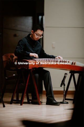 Our Nebraska: Express Yourself Expo in the Oasis Center. Chinese students playing traditional string