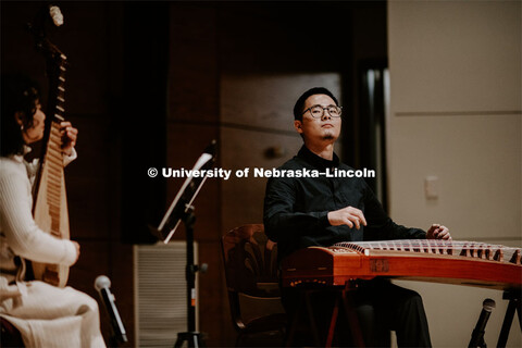 Our Nebraska: Express Yourself Expo in the Oasis Center. Chinese students playing traditional string