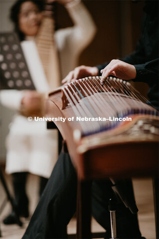 Our Nebraska: Express Yourself Expo in the Oasis Center. Chinese students playing traditional string