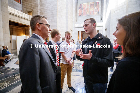 Chancellor Ronnie Green speaks with ASUN President Hunter Traynor and other UNL students in the capi