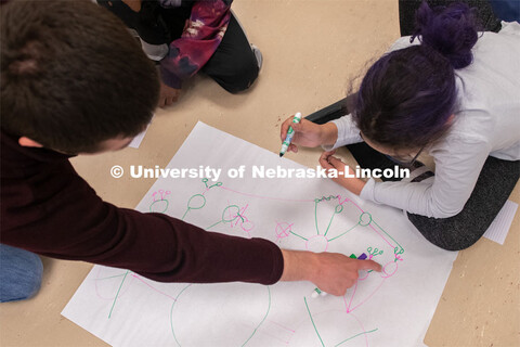 A middle-school student plays a game demonstrating network science and the efficacy of vaccinations 