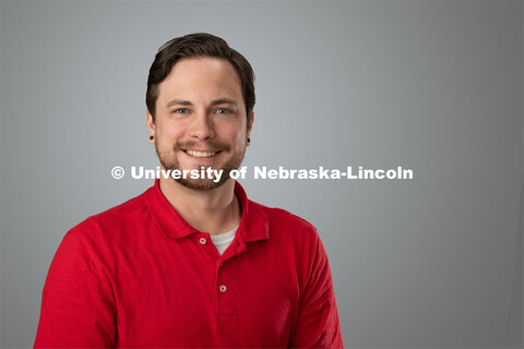 Studio portrait of AJ Weigman, Project Associate for Child, Youth and Family Studies. April 4, 2019.