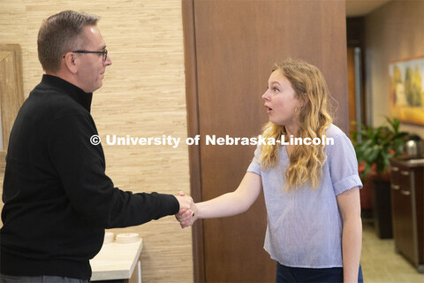 Emily Johnson, a junior at the University of Nebraska, reacts with surprise as Chancellor Ronnie Gre