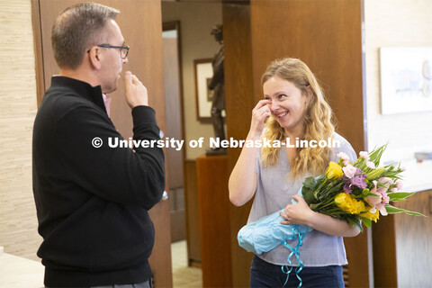 Emily Johnson, a junior at the University of Nebraska, reacts with surprise as Chancellor Ronnie Gre