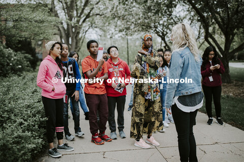 Morgan Mattly leads a group of Lexington, NE, middle schools students on a tour of campus Wednesday 