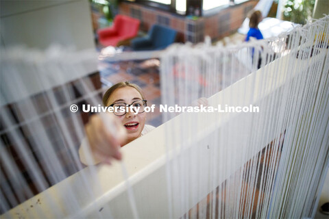 College of Architecture High School Workshop students use string to design in the atrium of the coll
