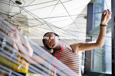 College of Architecture High School Workshop students use string to design in the atrium of the coll
