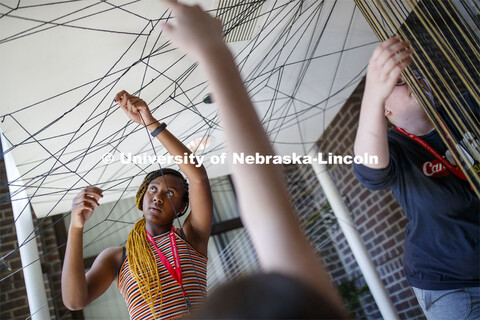 College of Architecture High School Workshop students use string to design in the atrium of the coll
