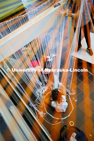 College of Architecture High School Workshop students use string to design in the atrium of the coll