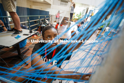 College of Architecture High School Workshop students use string to design in the atrium of the coll