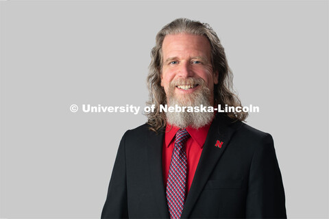 Studio portrait of Nathan Bruss, CRM Communications Specialist, Academic Services and Enrollment Man