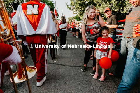 Kid excited to see The Cornhusker Marching Band march by. Nebraska vs. Northern Illinois football ga