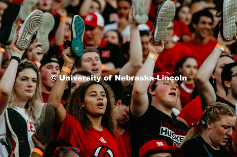 Students with shoes up for Shoes Off- Kickoff. Nebraska vs. Northern Illinois football game. Septemb