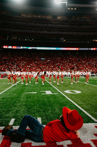 Herbie Husker lounges on the sideline as the Scarlets preform at the Nebraska vs. Northern Illinois 