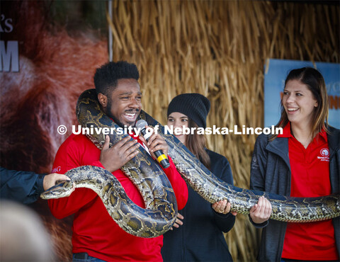 Emcee D-Wayne Taylor makes friends with a boa constrictor at the Mutual of Omaha animal exhibit. Cor