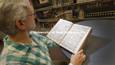 Anita Breckbill, professor and music librarian at the University of Nebraska–Lincoln, looks throug