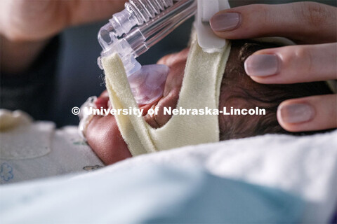 Erica Ryherd looks in on Ah'Mel, a patient at Nebraska Med’s Newborn Intensive Care Unit. Ah'Mel w