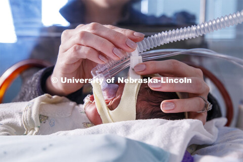 Erica Ryherd looks in on Ah'Mel, a patient at Nebraska Med’s Newborn Intensive Care Unit. Ah'Mel w