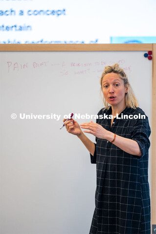 Assistant Professor Ash Smith writes on a marker board. Johnny Carson Center for Emerging Media Arts